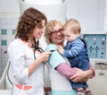 One year old baby playing with doctorÃ¢â¬â¢s stethoscope